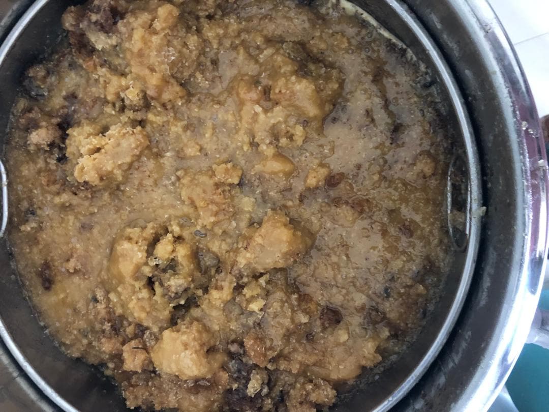 Raw honey in combs put in a basket.